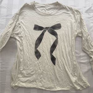 Cream Long Sleeve Top with Black Bow Design